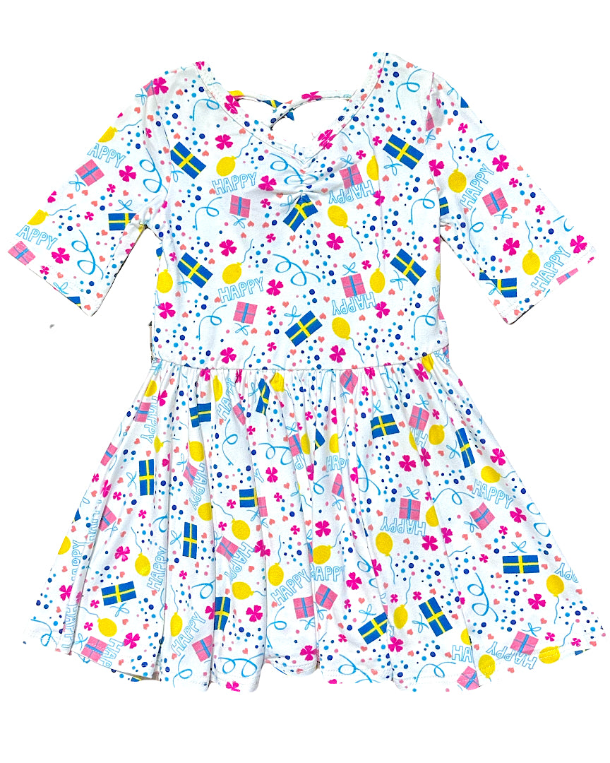 Girls party dress with HAPPY print, presents and balloons