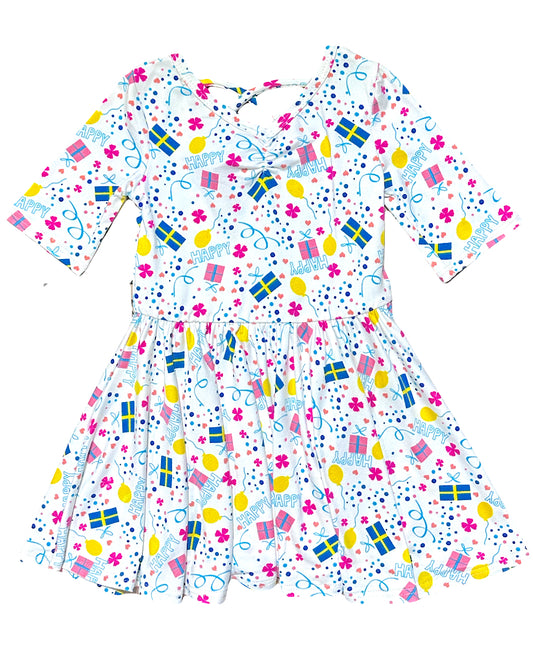 Girls party dress with HAPPY print, presents and balloons