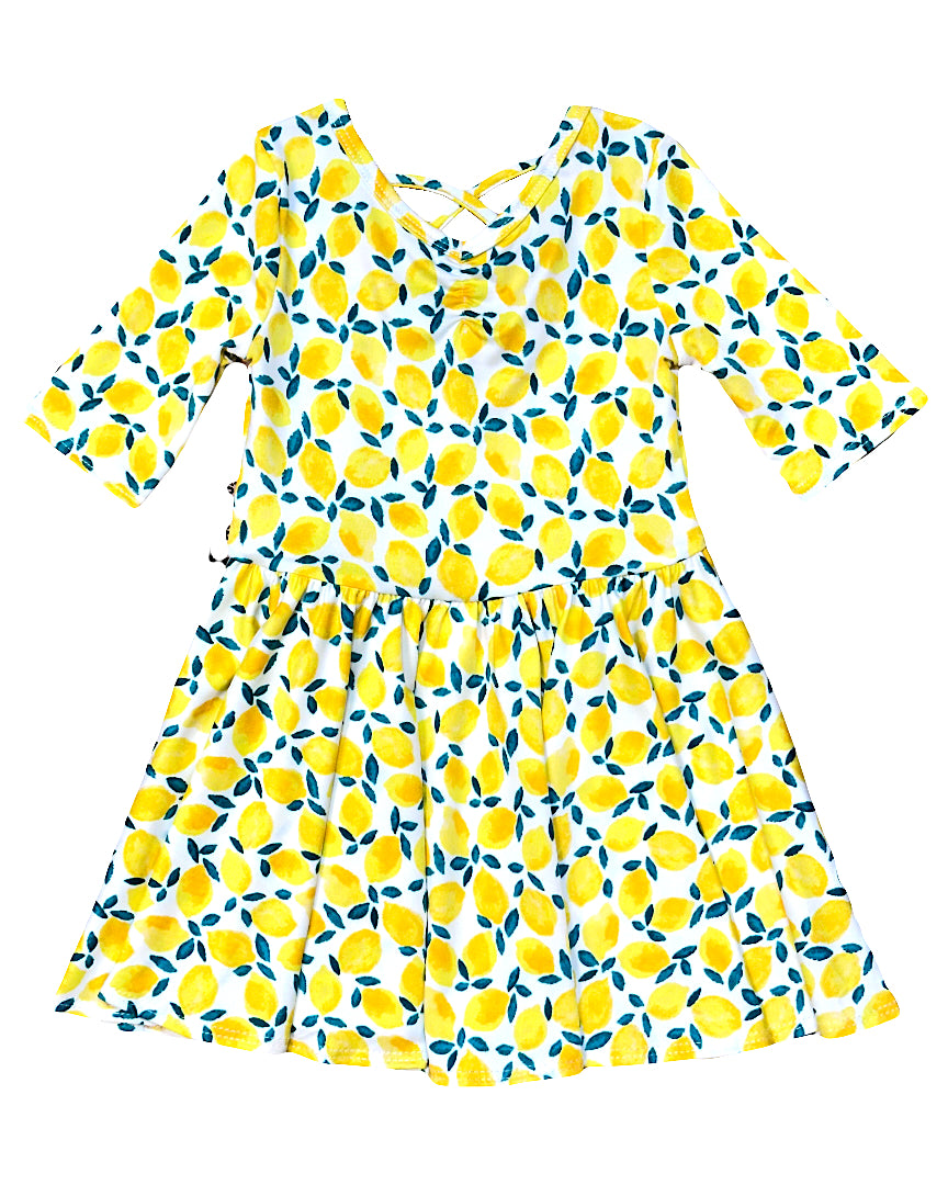 Girls lemon print ballerina dress with criss-cross back and twirl skirt
