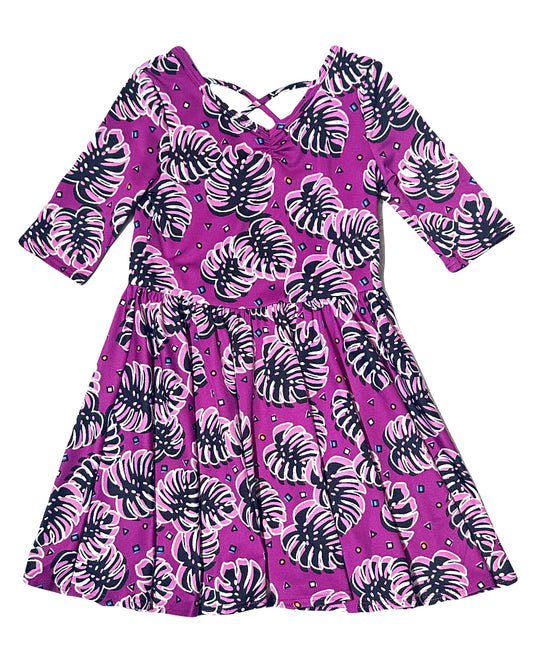 DotDotSmile Ballerina Dress with purple tropical monstera print – flat lay
